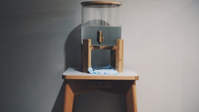 a glass container on a shelf