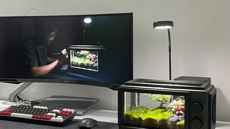 a flat screen tv sitting on top of a desk