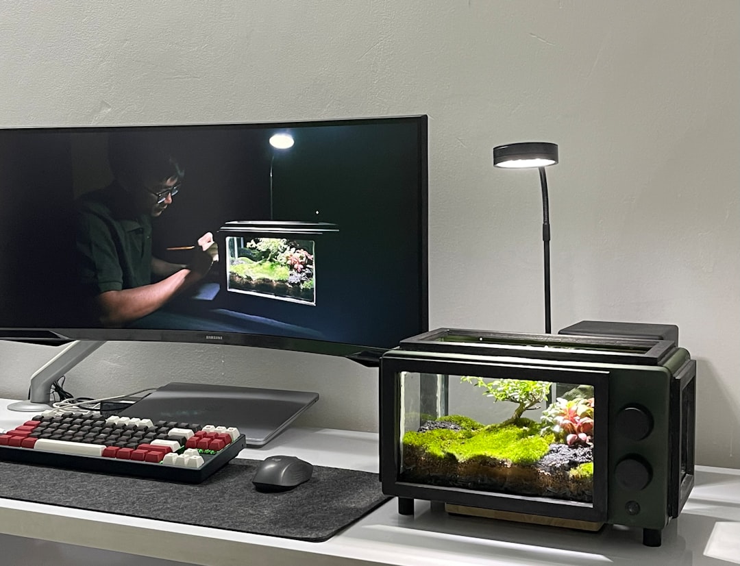 a flat screen tv sitting on top of a desk