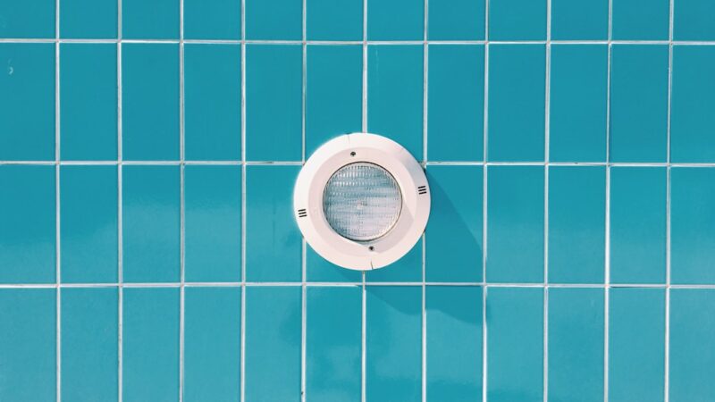 round white cordless device on blue surface